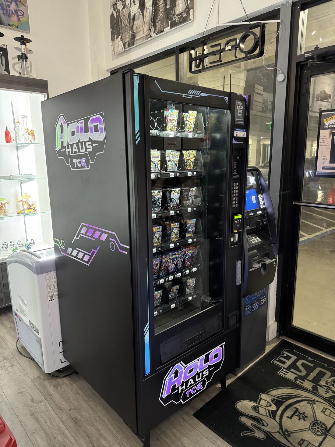 A Holo Haus trading card vending machine installed inside a retail store